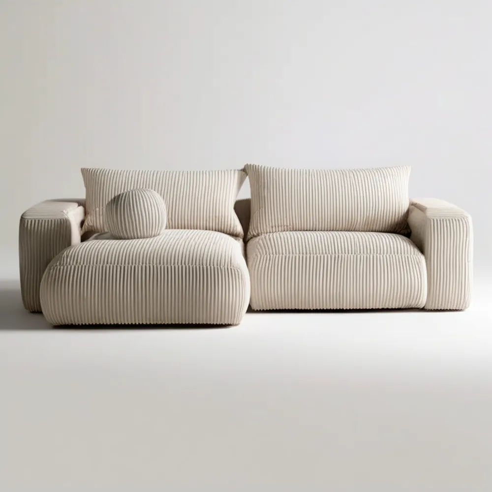 Kremowa sofa dwuosobowa ze sztruksową tapicerką i poduszką dekoracyjną 180 x 95 x 78 cm